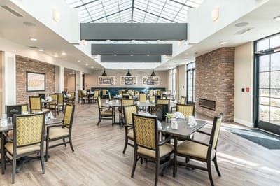 Modern dining room with large windows and tables