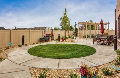 Outdoor patio area with seating and landscaping
