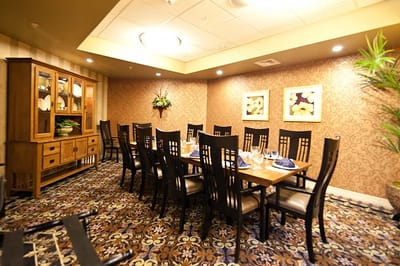 Elegant dining room setup with wooden furniture.