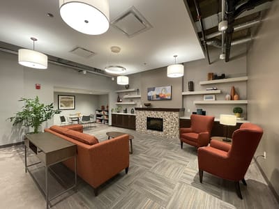 Cozy common area with seating and fireplace