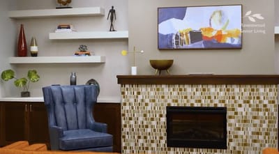 Interior lounge area with decorative fireplace and seating