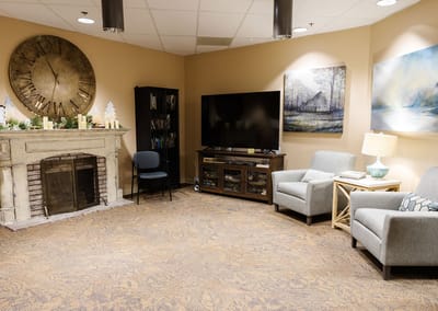 Common area with seating and a fireplace
