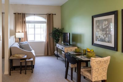 Cozy interior of a resident room with living and dining area