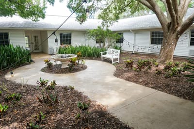 Outdoor courtyard featuring a seating area and plants