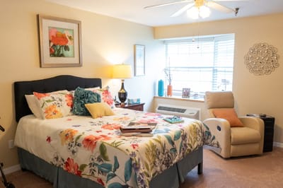 Cozy private room with floral bedding and natural light
