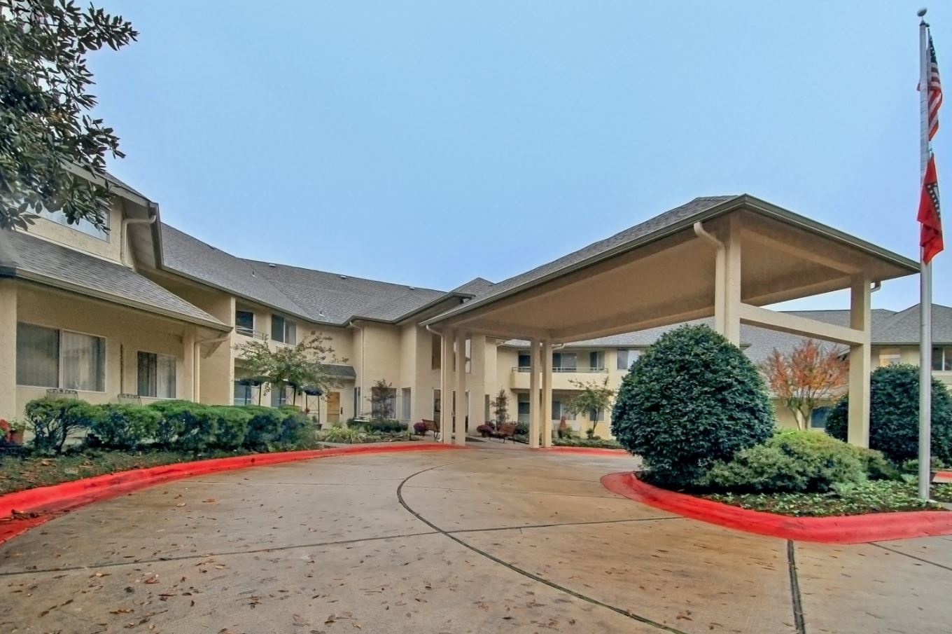 Exterior view of Holiday Andover Place with landscaping