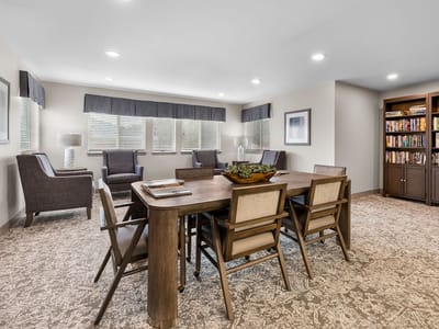 Bright common area with seating and bookshelves