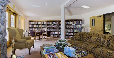 Interior view of a library with seating and bookshelves