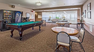 Interior common area with a pool table and seating