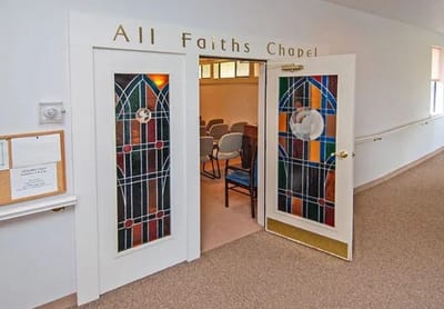 Entrance to the All Faiths Chapel with stained glass doors
