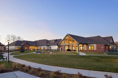Exterior view of Hover Senior Living Community at sunset