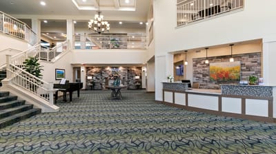 Interior view of a well-lit lobby with stairs