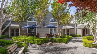 A beautifully landscaped courtyard with outdoor seating