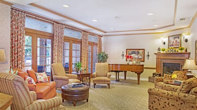 Cozy common area with comfortable seating and piano