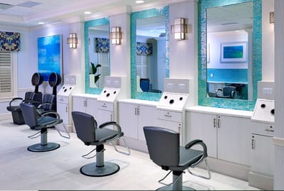 Beauty salon area with mirrors and styling chairs