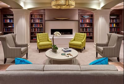 Bright common area with seating and bookshelves