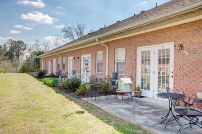 Outdoor patio area with seating at a senior living facility