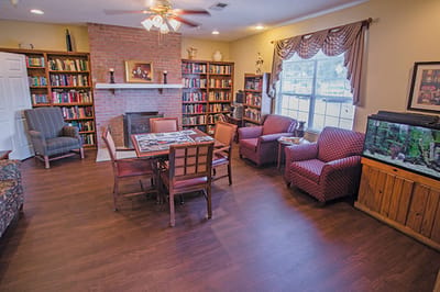 Cozy common area with bookshelves and seating