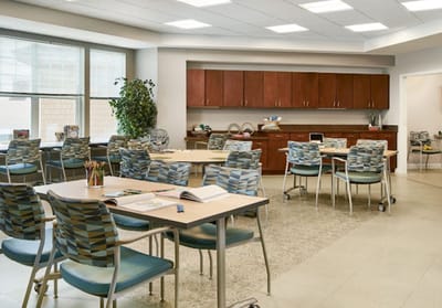 Bright activity room with tables and chairs