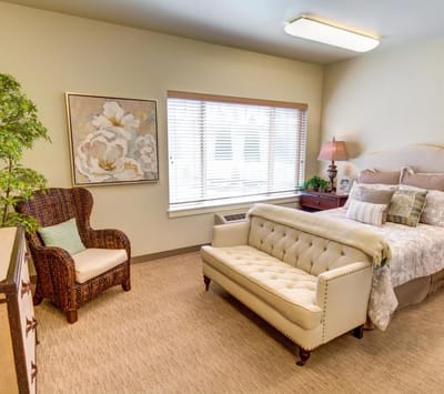 Well-decorated private resident room with natural light