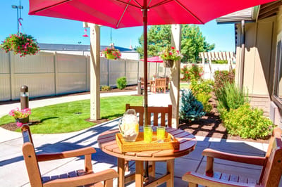 Outdoor patio area with seating and umbrellas