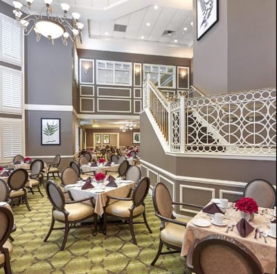 Elegant dining room with tables set for meals