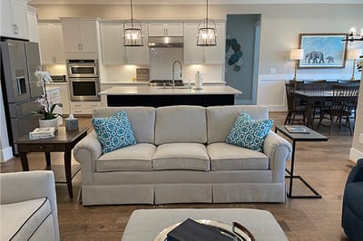 Bright interior of a common area with a sofa and dining space