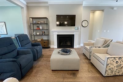 Cozy lounge area with seating and fireplace