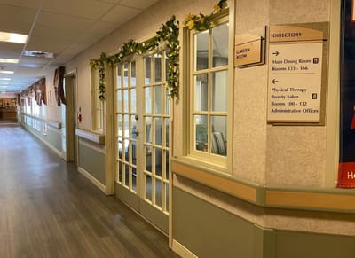 Interior hallway with directory and garden room access