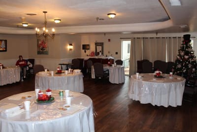 Dining area with festive table settings and decorations