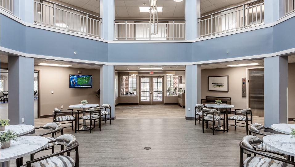 Interior view of a common area with tables and seating
