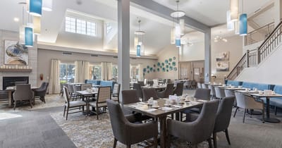 Bright dining room area with tables set for meals