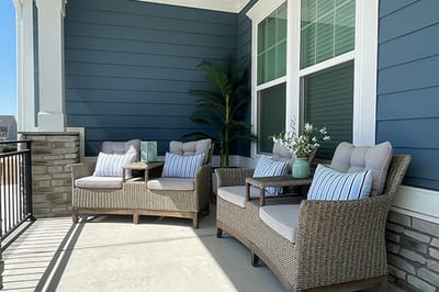 Outdoor seating area with comfortable chairs and plants