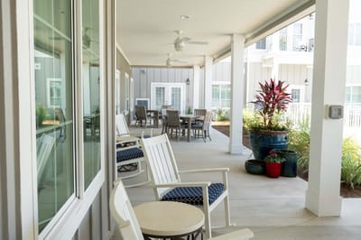 Covered outdoor seating area with tables and chairs