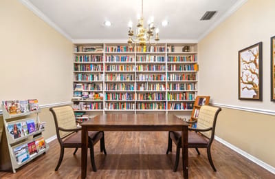Cozy reading area with bookshelves and a table