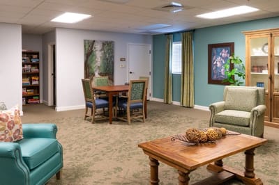 Bright common area with seating and games