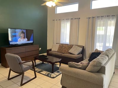 Cozy common area with seating and TV