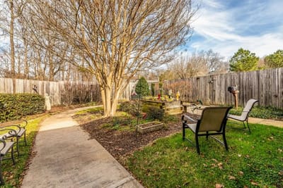 Outdoor garden area with benches and trees