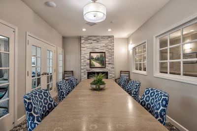 Interior view of a common area with a large dining table