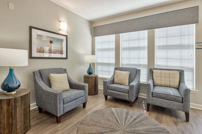 Cozy common area with comfortable seating and lamps