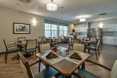 Dining area with tables set for residents
