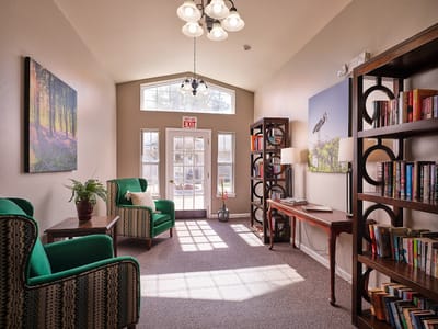 Bright and welcoming common area with seating and bookshelves