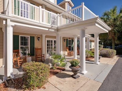Exterior view of the facility with rocking chairs