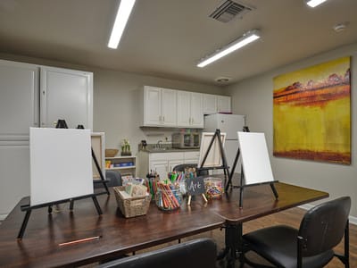 Activity room with art supplies and easels