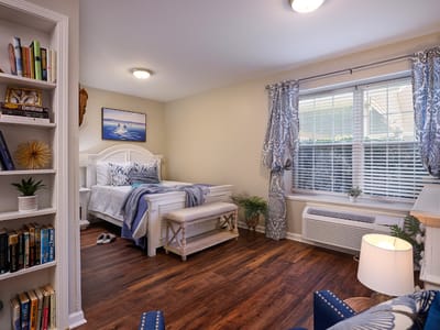 Bright and cozy bedroom with a small reading nook