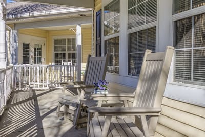 Rocking chairs on a porch with flower decoration