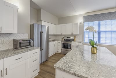 Bright kitchen with modern appliances and granite countertops
