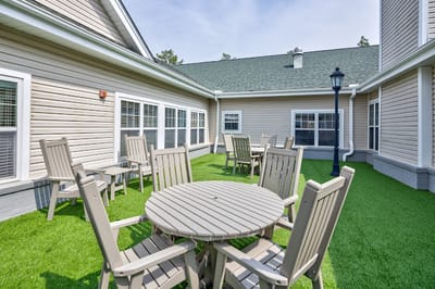 Outdoor seating area with tables and chairs