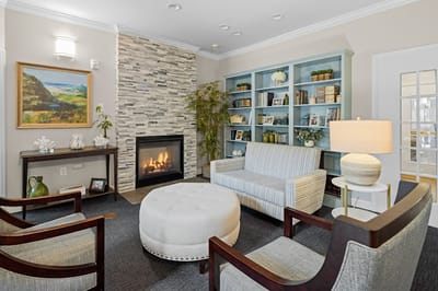 Cozy common area with comfortable seating and a fireplace