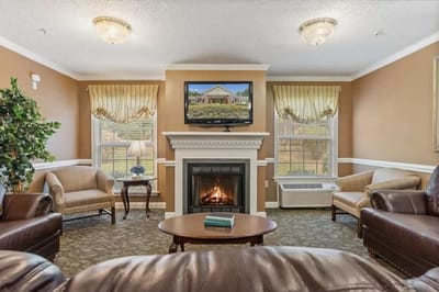 Cozy living room area with seating and a fireplace